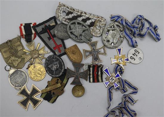 Three German Mutterehrenkreuz, a Winterschlact Im Osten medal, Third Reich Merit Cross, Black Wound badge and sundries